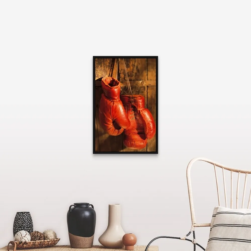"Boxing gloves hanging on rustic wooden wall" Black Float Frame Canvas Art