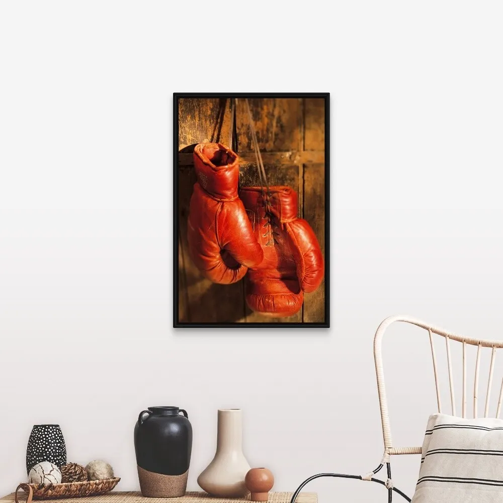 "Boxing gloves hanging on rustic wooden wall" Black Float Frame Canvas Art