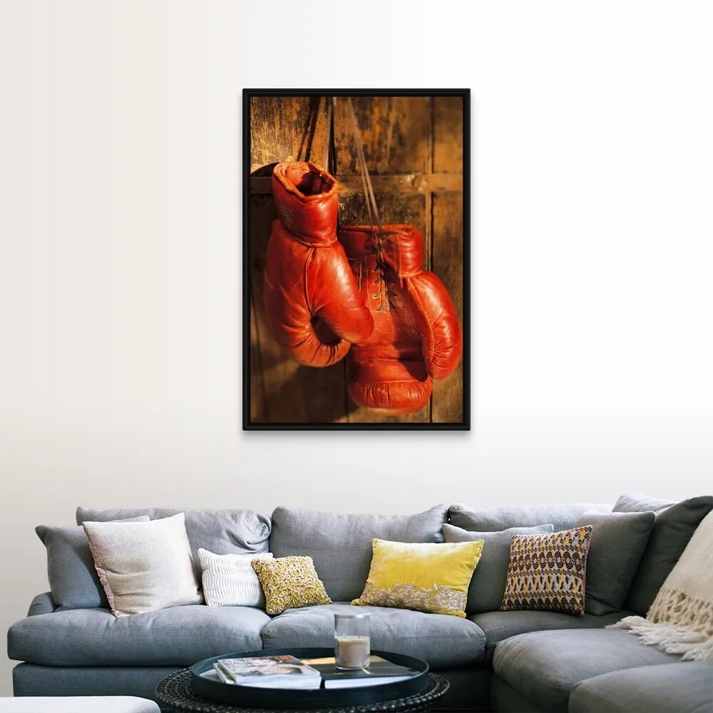 "Boxing gloves hanging on rustic wooden wall" Black Float Frame Canvas Art