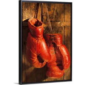 "Boxing gloves hanging on rustic wooden wall" Black Float Frame Canvas Art