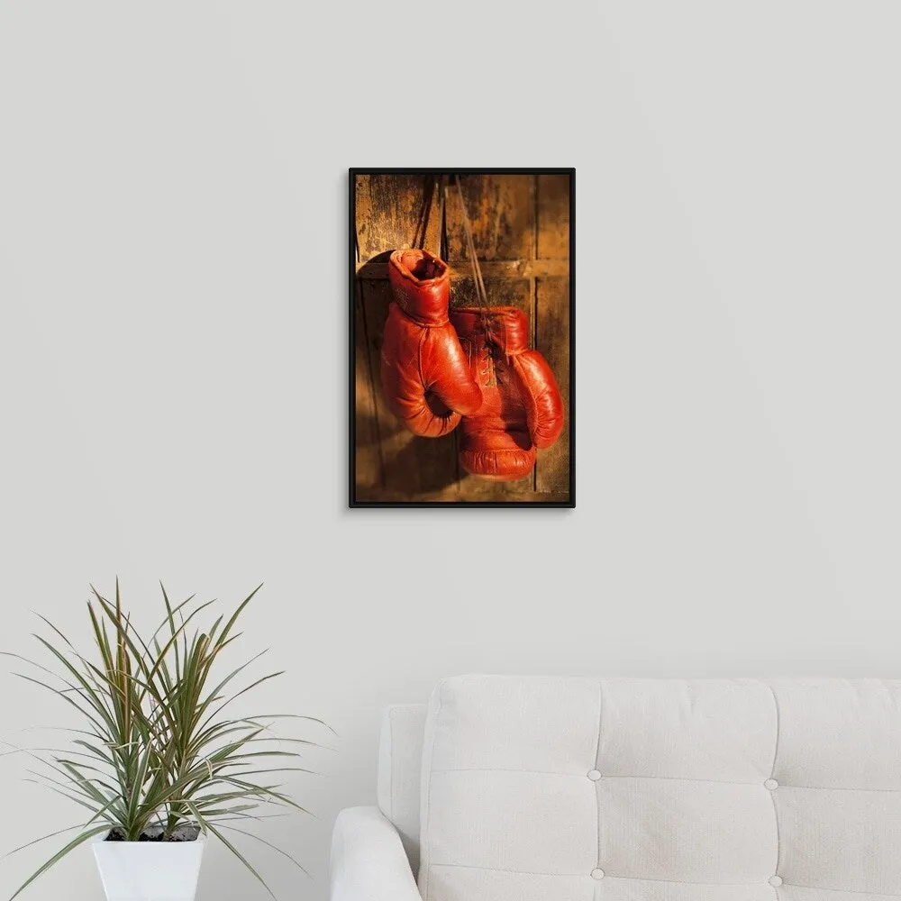 "Boxing gloves hanging on rustic wooden wall" Black Float Frame Canvas Art
